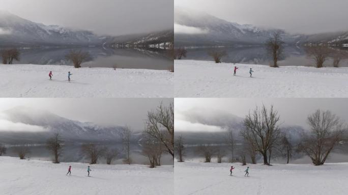 空中: 沿着两名运动员在斯洛文尼亚山区训练北欧滑雪。