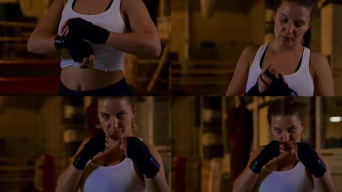 慢动作女拳击手固定绷带并在镜头前摆拳击姿势