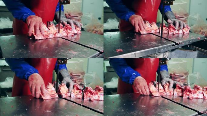 肉类加工厂，食品生产设施。工厂员工正在使用一种用肉切骨头的机制