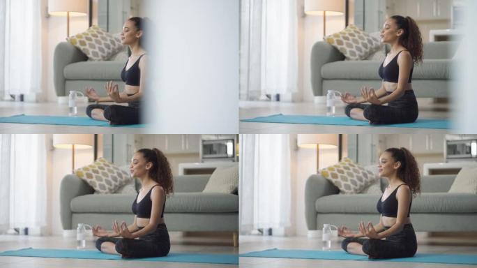 一名年轻女子在家冥想的4k录像
