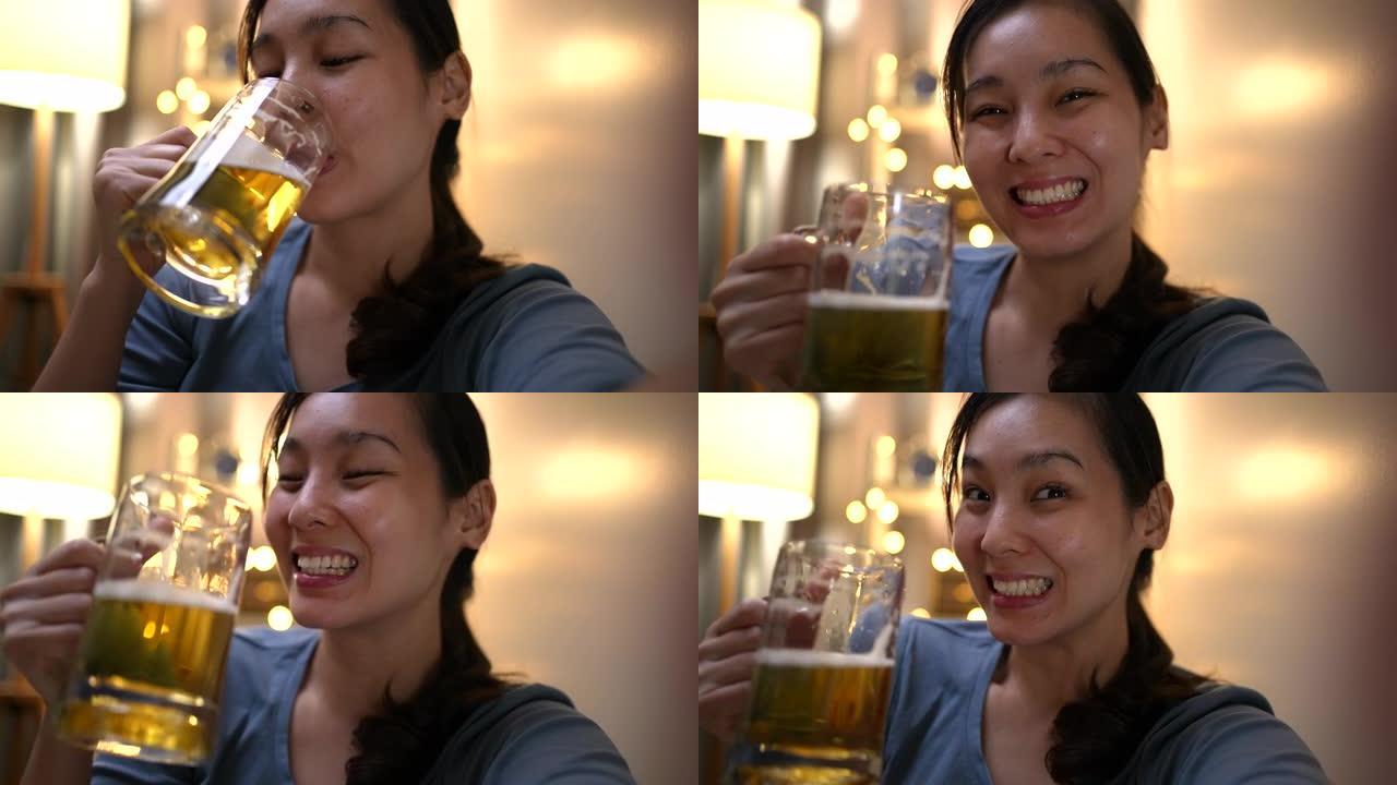 亚洲女性在智能手机上与朋友在啤酒上进行虚拟派对