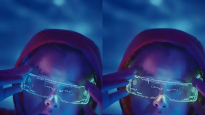 亚洲女性使用背景霓虹灯VR眼镜的垂直拍摄