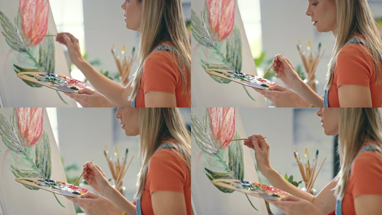 创意女艺术家在艺术工作室的画布上画一朵花。一位女画家用油画创作了一幅美丽的彩色静物画。女士表达了她的