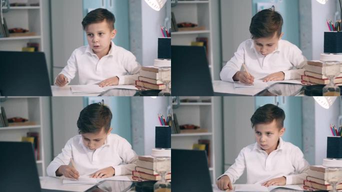 专注的小孩在在线课程中做笔记