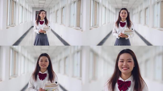 亚洲大学生走向相机的肖像