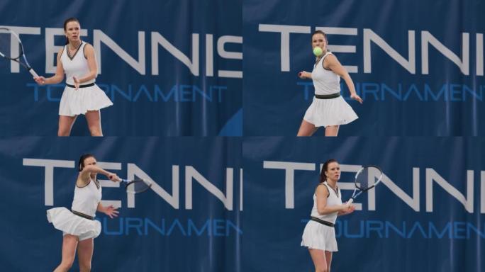 女子网球运动员在冠军赛中用球拍击球。职业女运动员获得并获得完美的反手射击。世界体育锦标赛。慢动作全镜