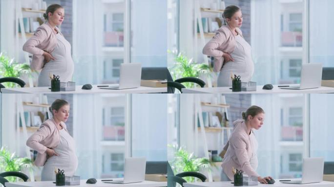 在现代办公室中使用笔记本电脑的孕妇的4k视频片段