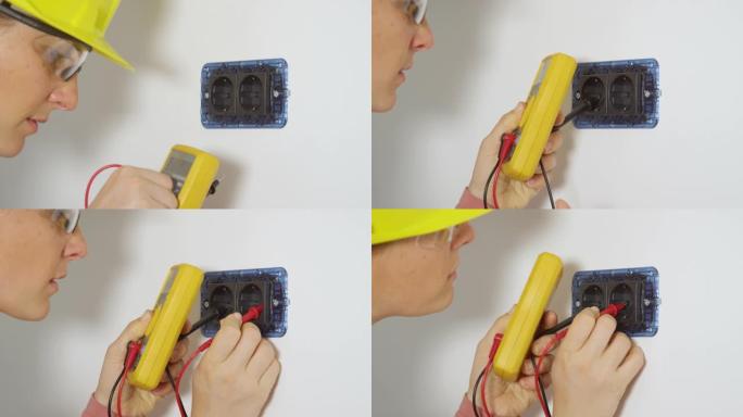 特写: 年轻的女电工用新的万用表检查一个插座。