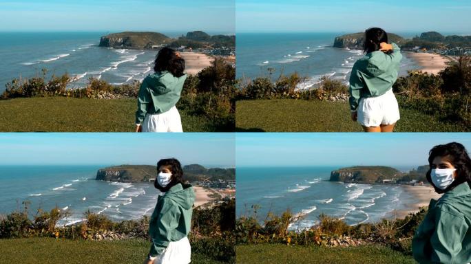 巴西南里奥格兰德州托雷斯海滩，戴着太阳镜和防护面罩的女人，欣赏海景