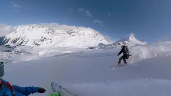 自拍照: 男女旅行者在落基山脉的heliboarding旅行中玩得开心