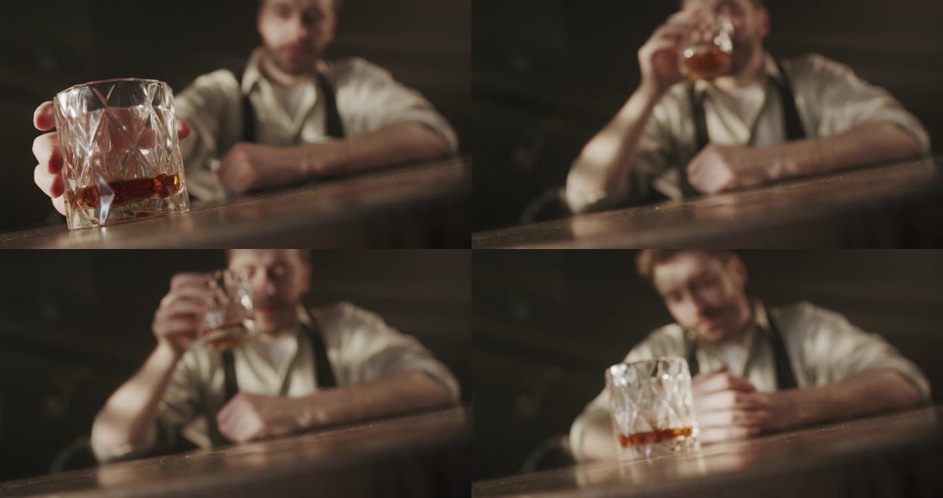 一段视频，视频的前景是一杯威士忌，一个男人拿了一杯饮料，然后把它放回他面前的桌子上
