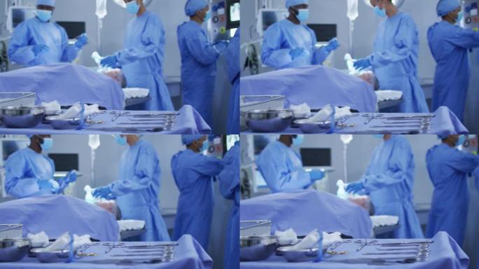 混血外科医生穿着防护服使患者在手术室中入睡