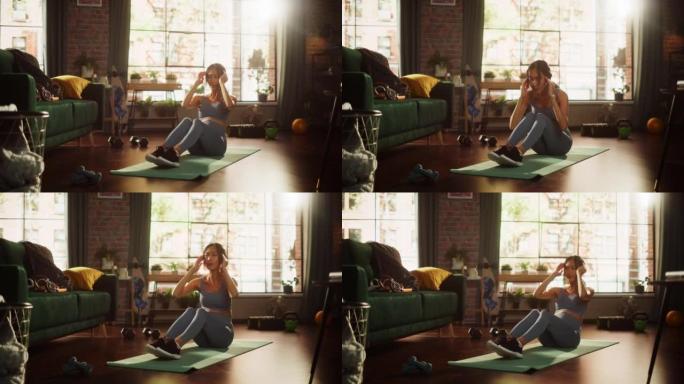 一位美丽的亚洲运动女性的肖像在家里做腹肌嘎吱锻炼、瑜伽、伸展运动、训练。阳光公寓，积极微笑的健康女人