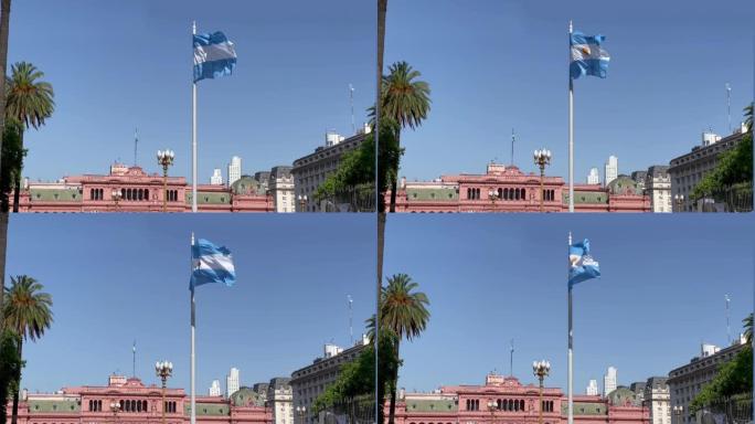 阿根廷国旗在梅奥广场 (英语: May Square)，背景是布宜诺斯艾利斯中心的Casa Rosa