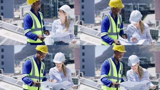 一个年轻的男人和一个女人在建筑物的屋顶上安装太阳能电池板。多元化的团队在可再生能源建筑项目中讨论和讨
