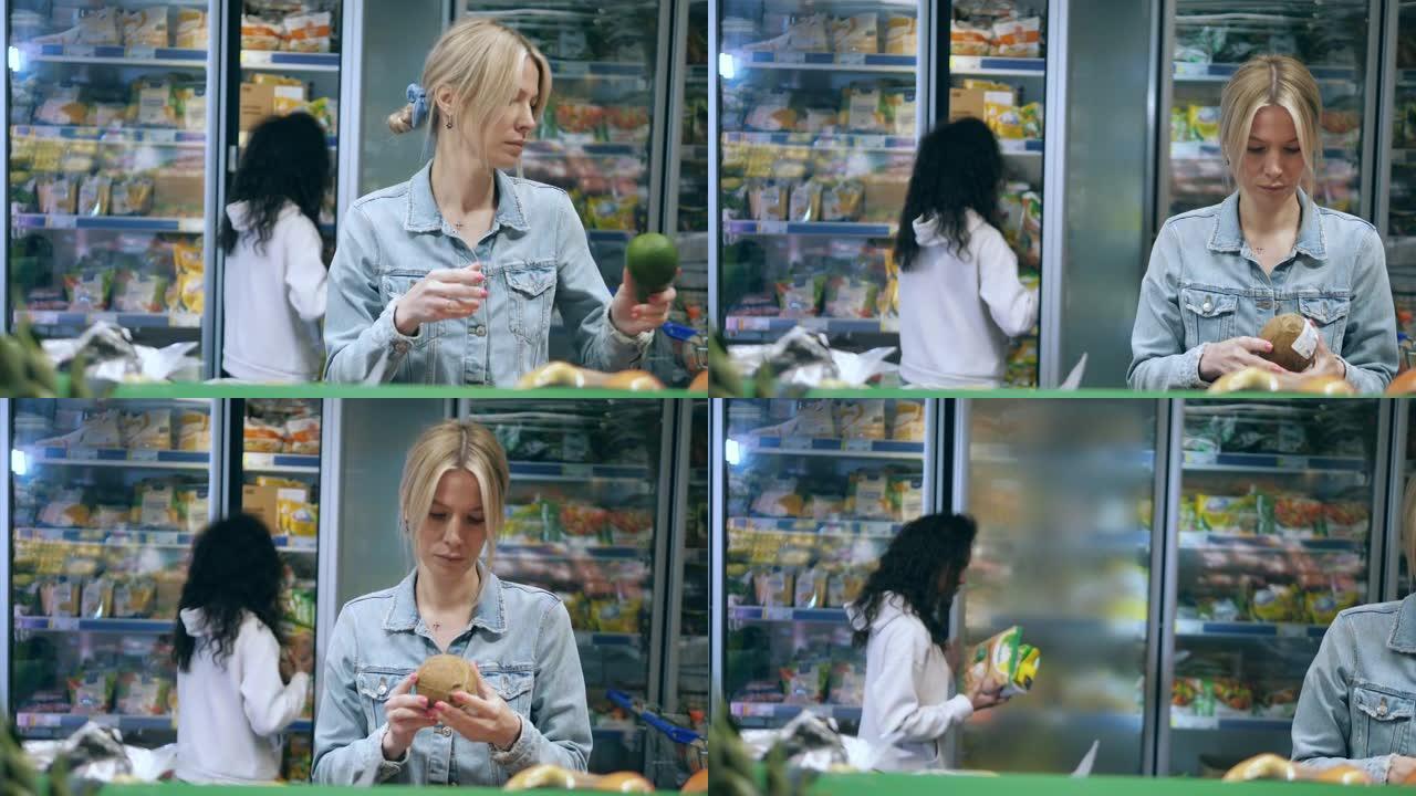 妇女在商店里购买水果和冷冻食品