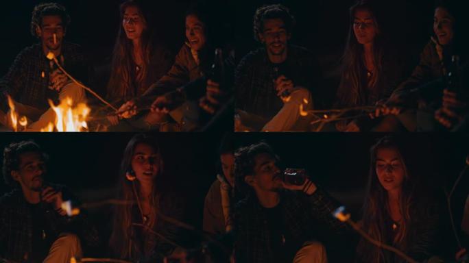 女孩吃棉花糖，和朋友在篝火上喝酒
