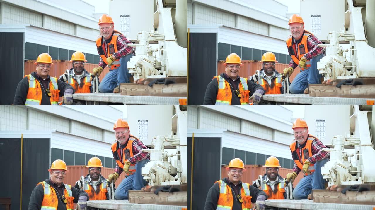 三名多种族建筑工人在镜头前微笑