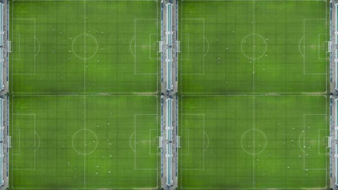 足球场和两支专业球队比赛的空中俯视图。国际锦标赛转播的足球比赛开始。缩小整个体育场的静电