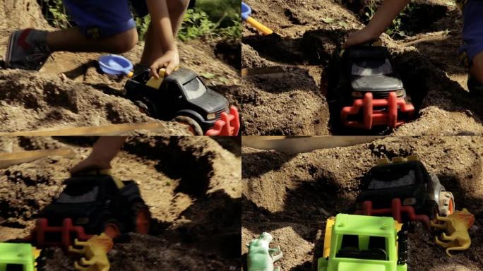 小男孩在院子里玩塑料玩具车。特写。