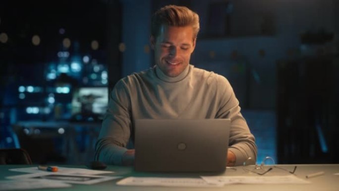 帅哥晚上在公司办公室工作笔记本电脑。年轻的专家分析报告。营销助理为客户制定消费者销售策略。