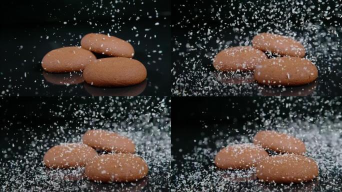 宏观: 白色椰子片在空桌子上的巧克力饼干上积雪。