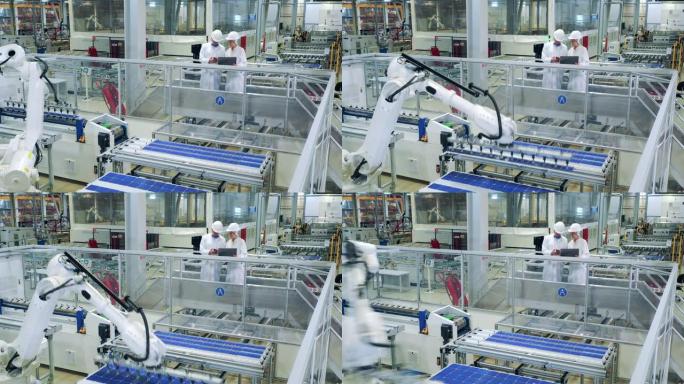 工厂单位有两名专家和一个机器人重新安置太阳能电池板