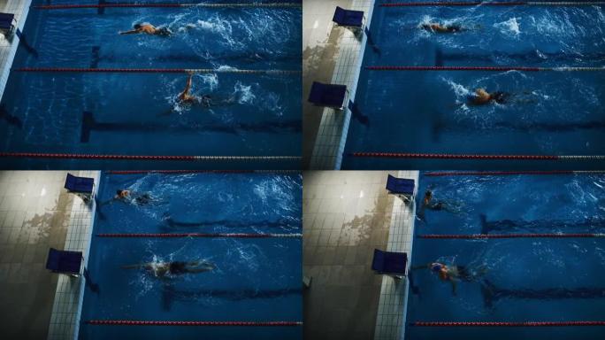 游泳比赛: 两名专业游泳运动员在游泳池跳跳水。运动员争夺最佳冠军。慢动作，空中俯视图跟踪镜头。深色戏