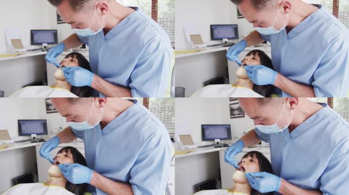 在现代牙科诊所用口罩检查女性患者牙齿的高加索男性牙医