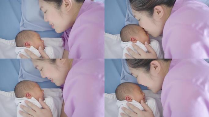 母亲带着婴儿带着爱，分娩后在医院接受治疗