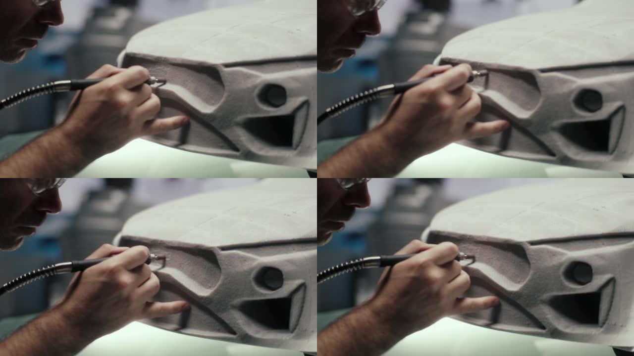 高级汽车设计师使用旋转工具来完善原型汽车的雕塑