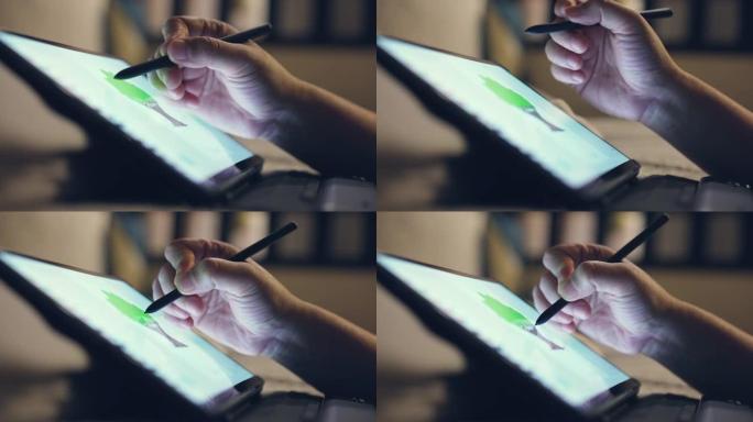 在数字平板电脑上使用数字铅笔画的手特写