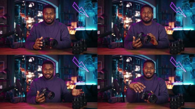 年轻的非洲裔美国人在录制有关新的摄影相机和视频设备的播客时对着麦克风说话。自信的黑人男性解释社交媒体