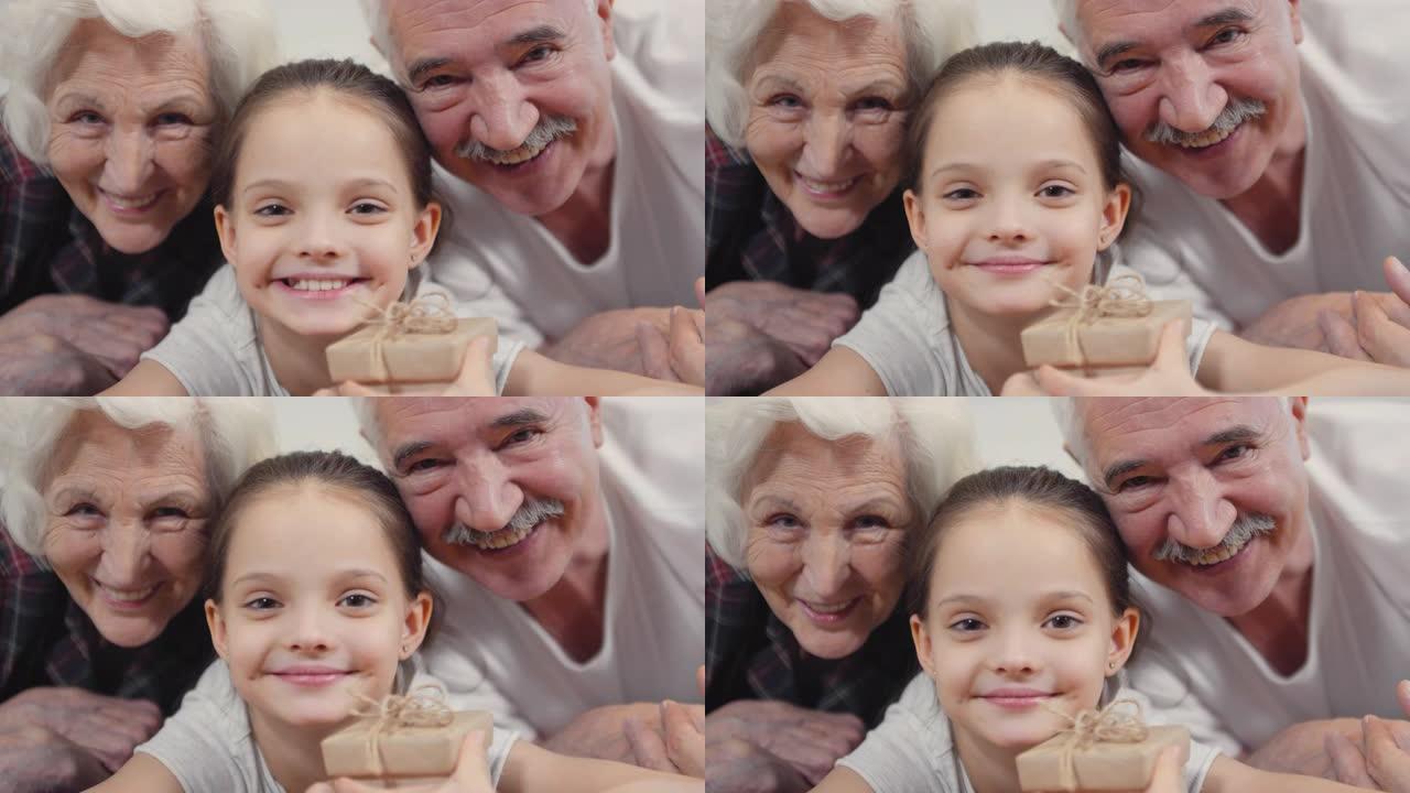 祖父母和小女孩微笑的特写