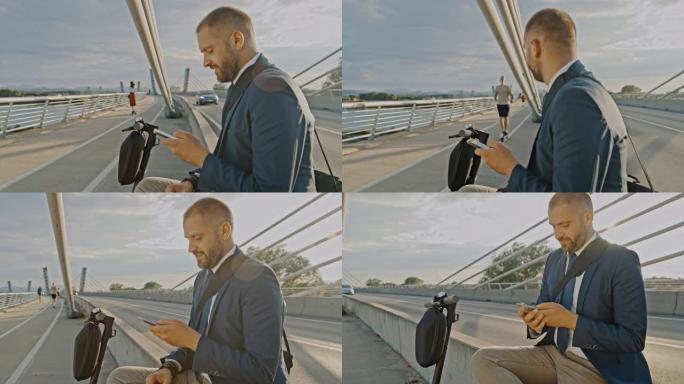 SLO MO Hipster在桥上使用他的智能手机