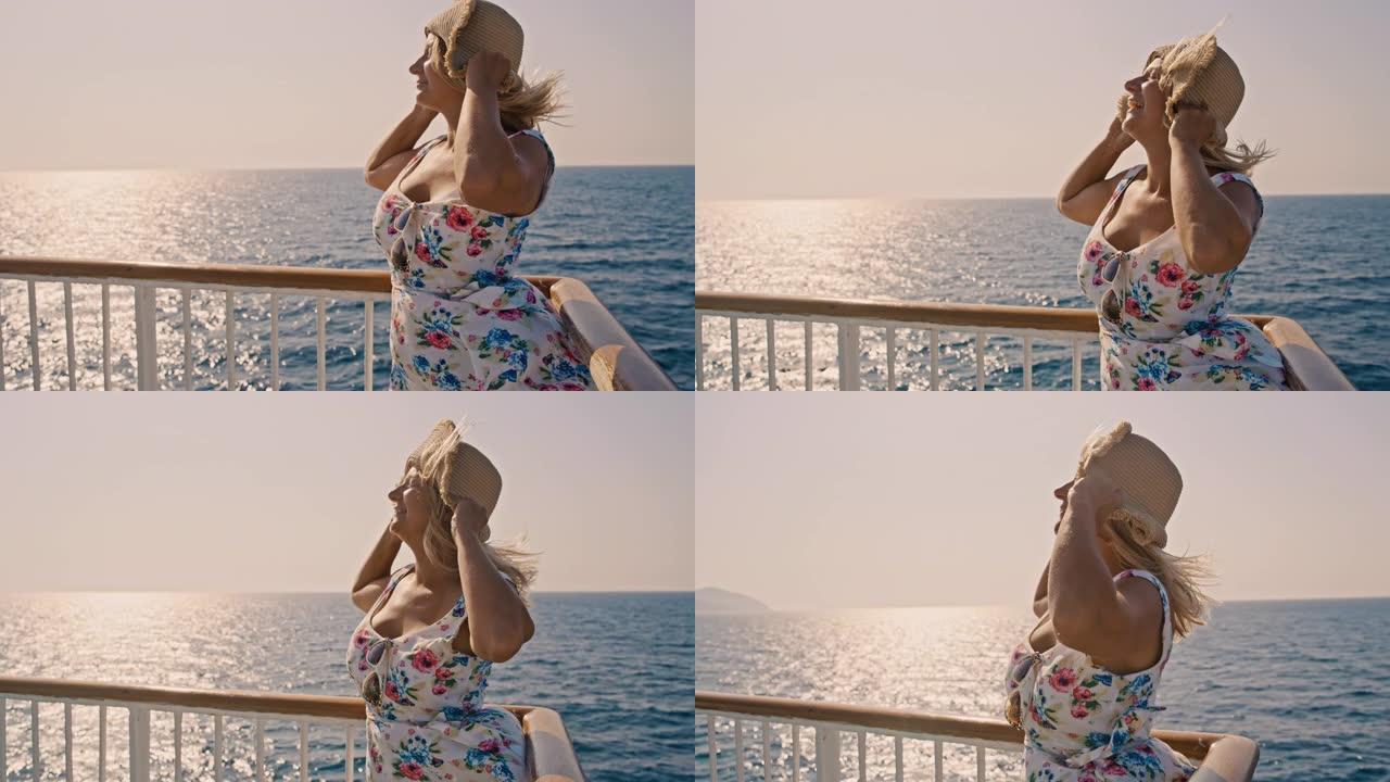 女士在克罗地亚亚得里亚海的风船上穿着遮阳裙和帽子的无忧无虑的年轻女子
