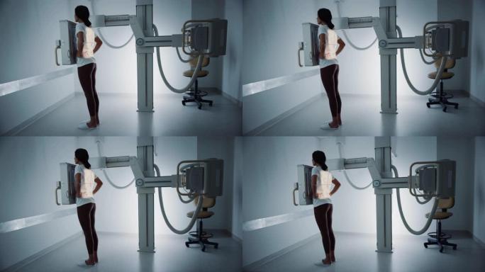 医院放射科室: 站在x光机里的美丽的多民族妇女。成年女性接受医学检查，并在现代诊所办公室扫描胸部，背
