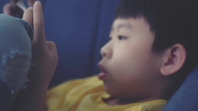 亚洲男孩使用电话沉迷电子鸦片