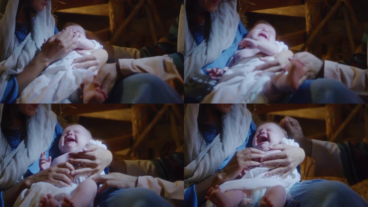 玛丽和约瑟夫抚摸婴儿耶稣