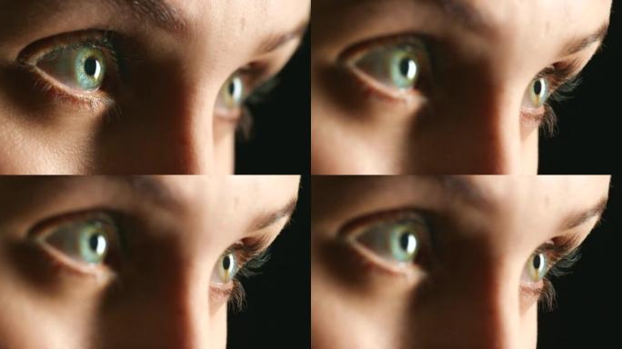 在深色或黑色背景模型上进行验光或人体解剖的女性面部的眼睛、视力和焦点。好奇的人的眼睛特写为人类意识或