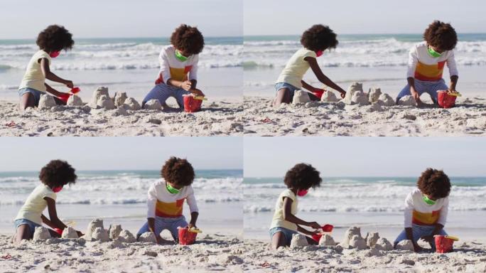 非裔美国儿童戴着口罩在沙滩上玩沙子