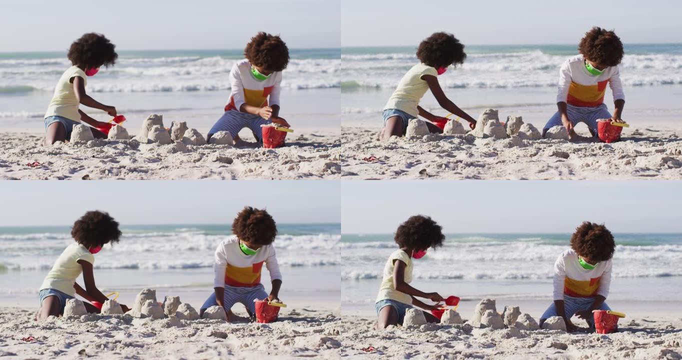 非裔美国儿童戴着口罩在沙滩上玩沙子