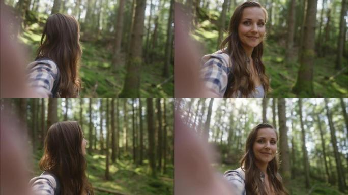 女人在森林里拍摄自己的徒步旅行
