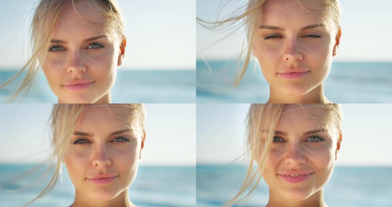 年轻微笑的金发女人的慢动作很高兴在阳光明媚的日子里在海边享受暑假。