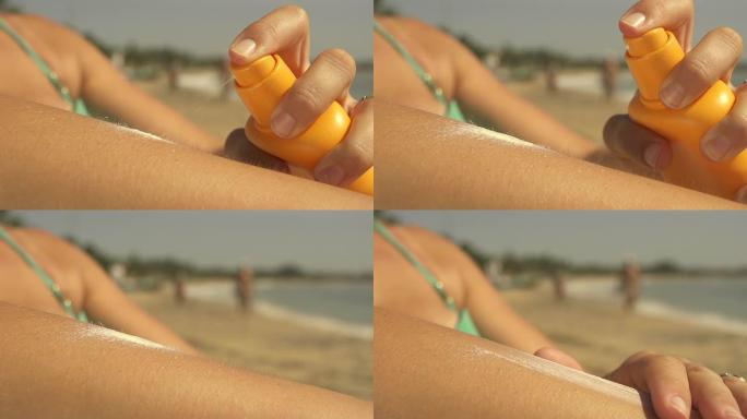 女性在海滩上使用防晒霜
