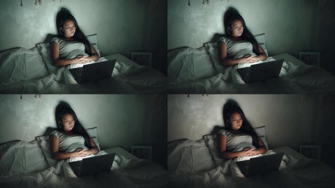 女人在床上看电影一个人躺着独居生活夜晚睡