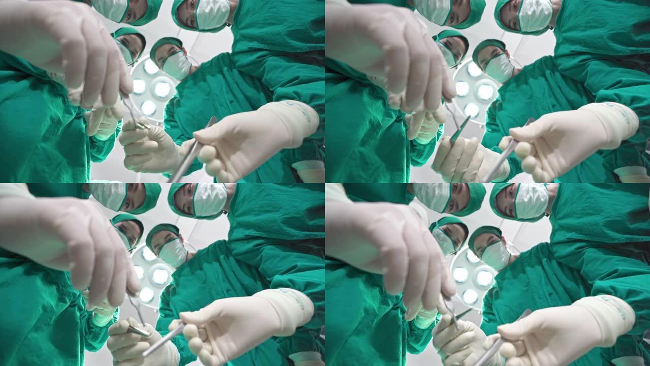 4K UHD观点: 一组外科医生在医院手术室为冠状病毒新型冠状病毒肺炎患者做胸部手术。医院医疗保健概