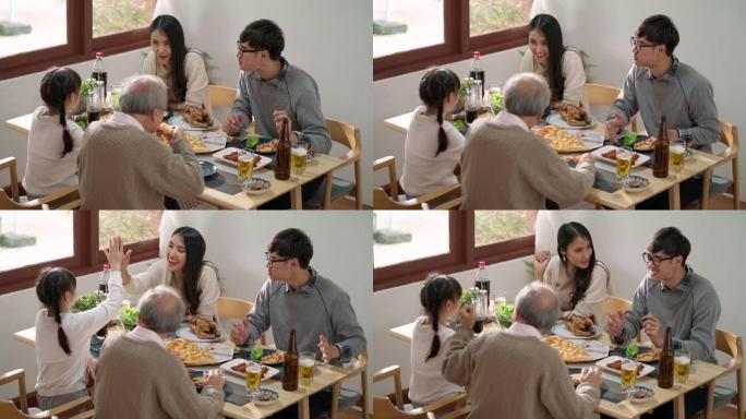 4K UHD手持高角度视图: 快乐的亚洲多代家庭在家里一起吃饭。