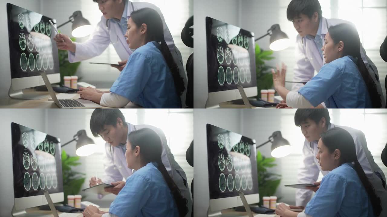 两名女医生在医院办公室的计算机上看脑部扫描显示