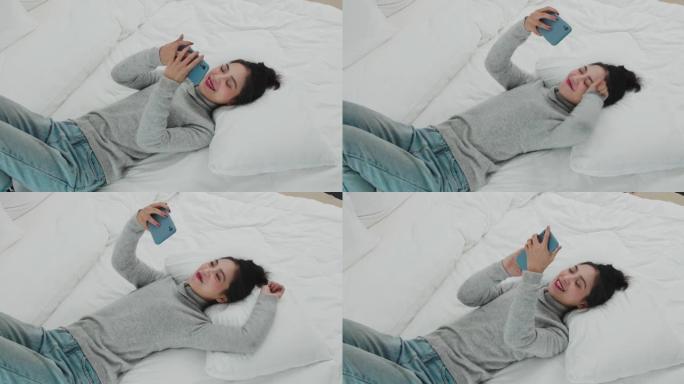 年轻女孩在床上聊天